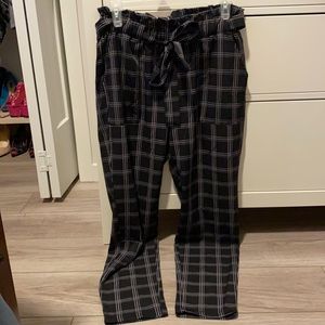 Black plaid pants. Loose fit.